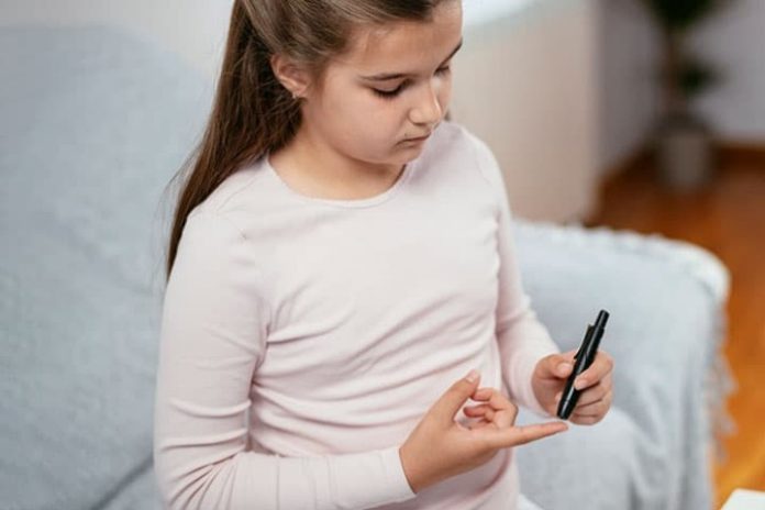 child-girl-checking-blood-sugar
